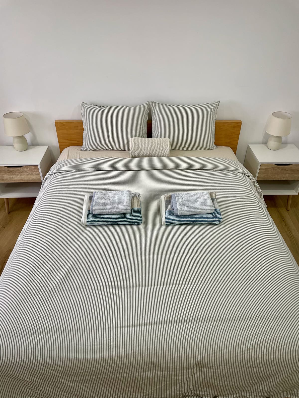 En-suite master bedroom at Casa Tarapacana with a double bed and folded towels
