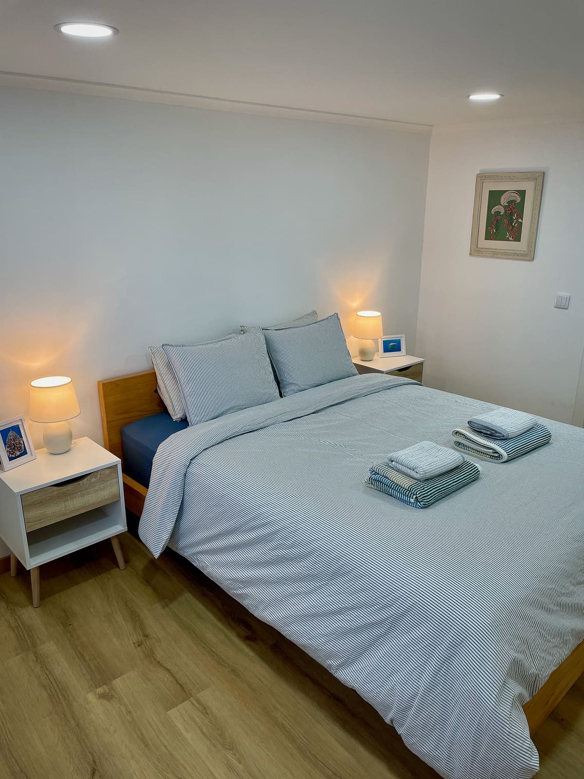 Casa Tarapacana master bedroom with white linens and bedside lamps